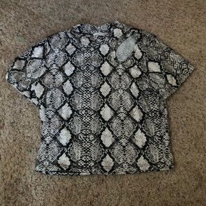 snake print snug kinda crop top. low turtle neck. little hole on left shoulder